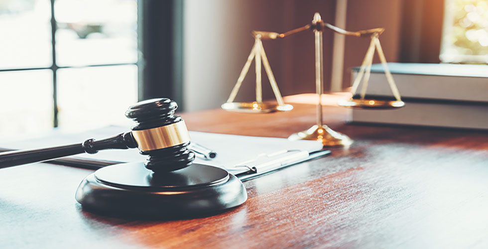 gavel and legal scales on a desk